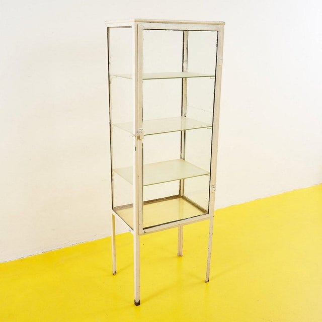 Vintage Doctor's Office Display Cabinet Height: 150 Width: 50 Depth: 35.5 Style: VINTAGE Production Period: 1970 -1979...