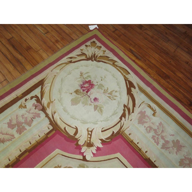 Classic 19th century French Aubusson with an ivory ground. Accents in pink and brown. Overall very good condition. Size:...