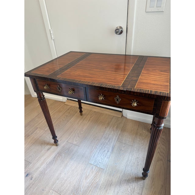 An exceptional Theodore Alexander “Rep·li·ca” Macassar Ebony & Rosewood Games Table, inspired by an early 19th-century...