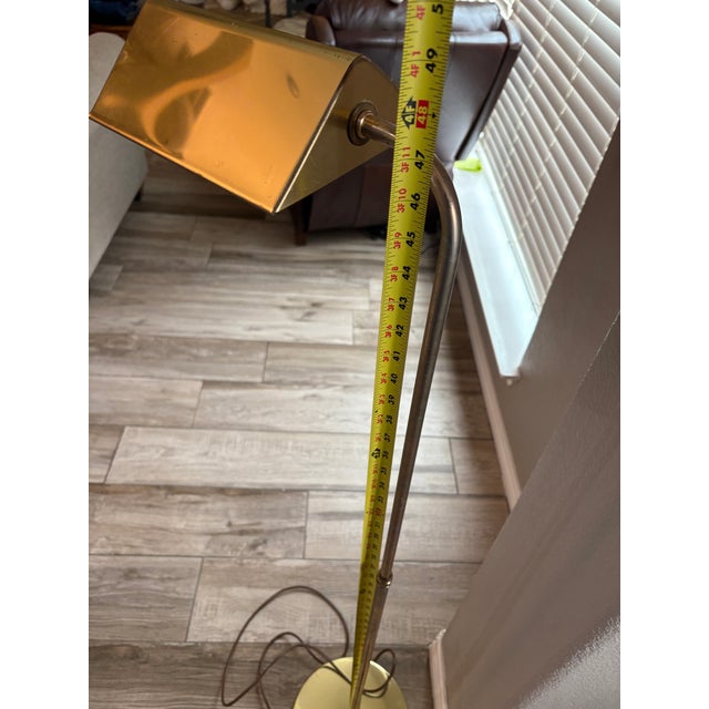 Beautiful brass reading lamp. Adjustable height. Mid-century modern brass floor lamp, often referred to as a "pharmacy...