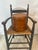 This is a charming antique high-back child’s chair, likely from the 19th or early 20th century. Here’s a detailed...