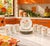 A vintage set of six salad plates and six cups in the "Painted Poppy" pattern by Japan Porcelain, featuring multi-color...