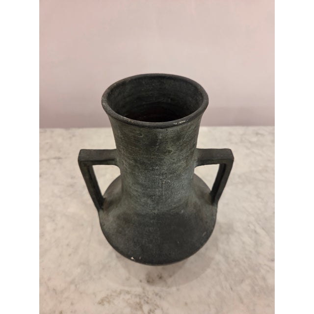 Dark metal Vase with handles, wide opening, and sturdy base