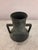 Dark metal Vase with handles, wide opening, and sturdy base