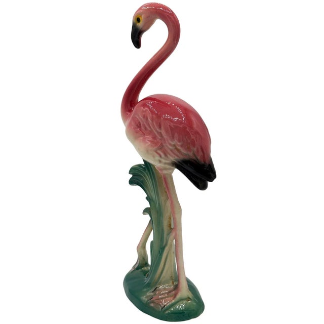 Mid-century pink and green long-legged "The Stroller" flamingo ceramic figurine. The statue detailed a pink flamingo with...