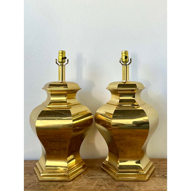 These striking vintage table lamps are a masterful celebration of Hollywood Regency glamour and late mid-century...