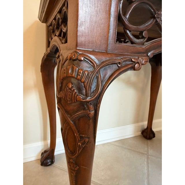 Exquisite quality with incredible workmanship, this high style reproduction Chippendale Tea Table was purportedly copied...