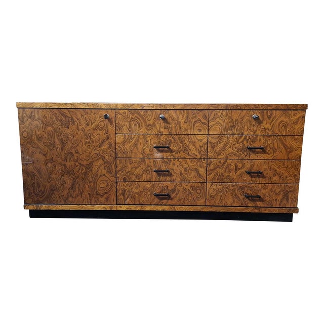 Splendid mid-20th century sideboard finished in thuja root. The cabinet is equipped with eight drawers (the two upper ones...