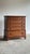 This vintage five-drawer dresser features a clean transitional silhouette with softly rounded edges, paneled sides, and...