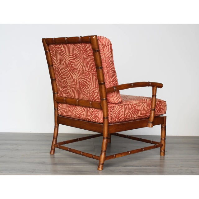 This is a pair of faux bamboo club chairs newly upholstered in a salmon floral textile This chair are in great vintage...