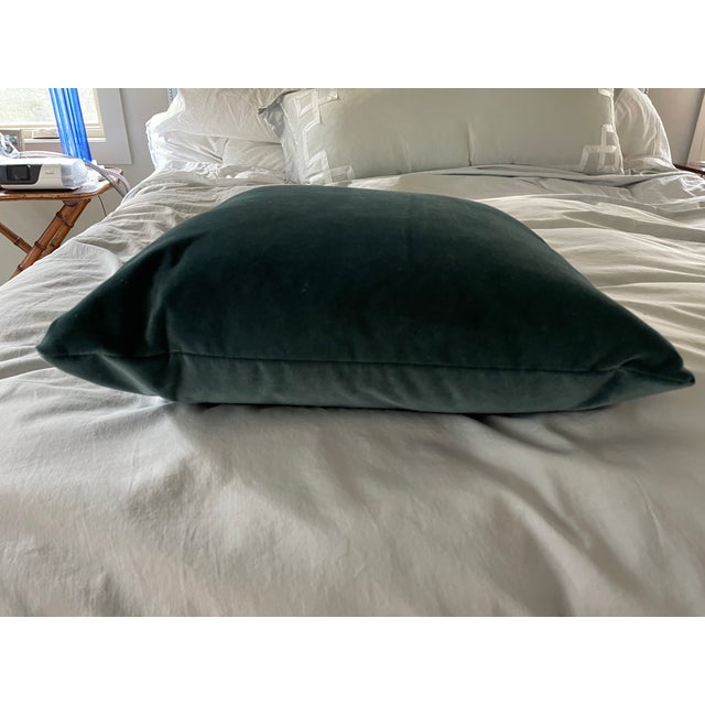 Velvet pillows with down inserts and zipper closure. The blue is a dark teal, similar to Sherwin Williams Seaworthy 7620...