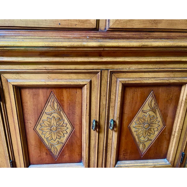 This is an early 1960s French Provincial display and buffet Cabinet from top-brand cabinet maker, Thomasville. This is a...