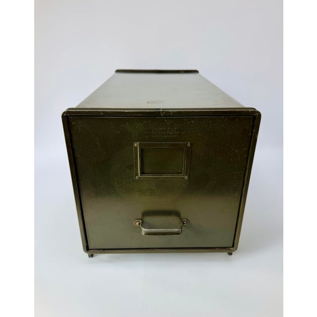 An early steel transfer-file cabinet by The General Fireproofing Company of Youngstown, Ohio. The long single drawer...