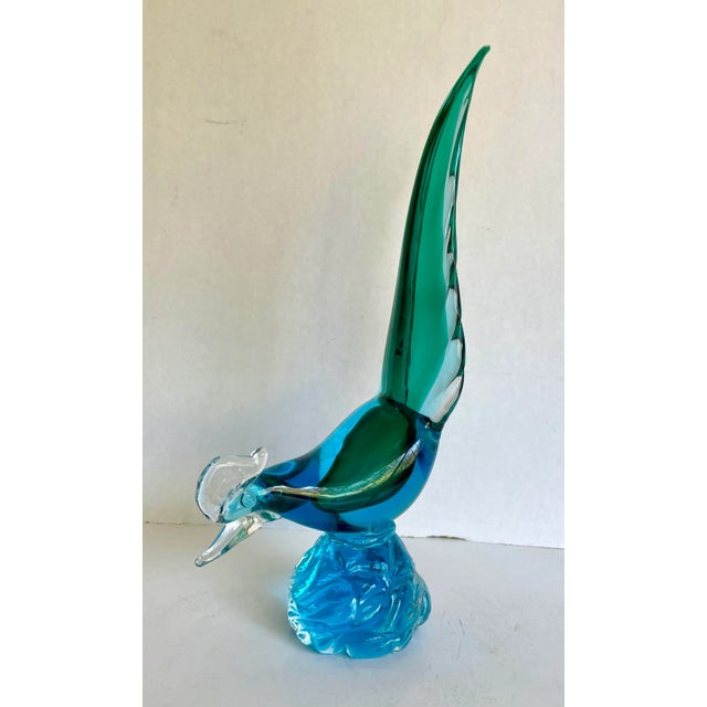 Here is a beautiful piece of art glass in the figure of a pheasant. The bird is perched, showing off it's gorgeous blue...