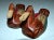 Pair of carved wood decoys painted with natural pigments. Smaller, 7"L x 3.5"W x 3.5"H.