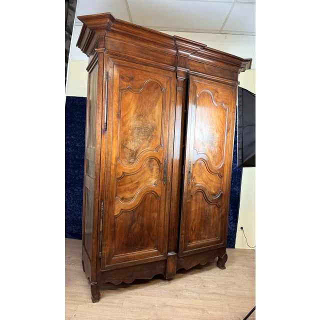 Magnificent louis xv period cabinet in solid walnut circa 1750. front opening with 2 panelled leaves central frame...
