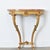 A dramatic 19th century Neoclassical demilune-console from France, with an exquisite giltwood base supporting an...