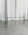A timeless coffee table made of clear bent glass. Its transparent appearance lightens the space and fits perfectly into...