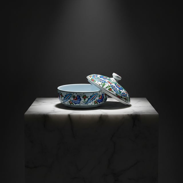 The Garden Box This Handmade Ceramic Lidded Bowl redefines the traditional container with a sleek, low profile silhouette....