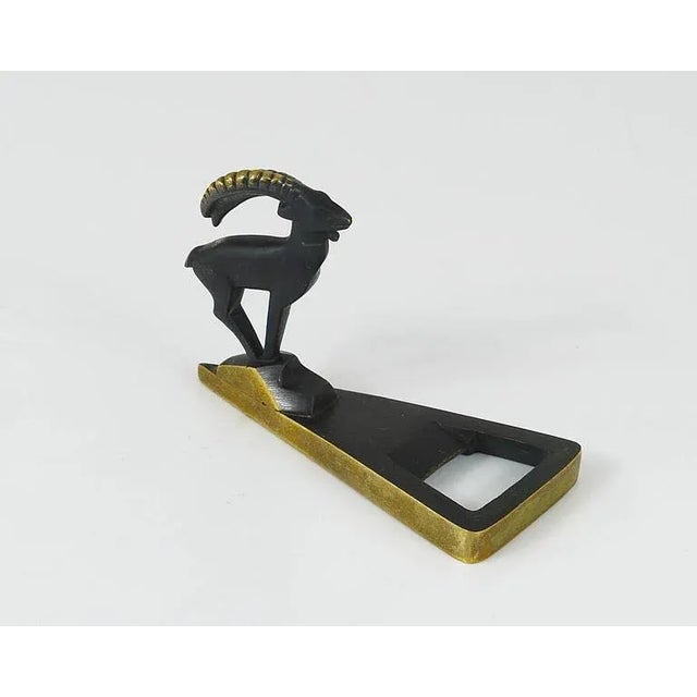 A beautiful modernist bottle opener with a Capricorn figurine from the 1950s, made of brass. Executed by Hertha Baller,...
