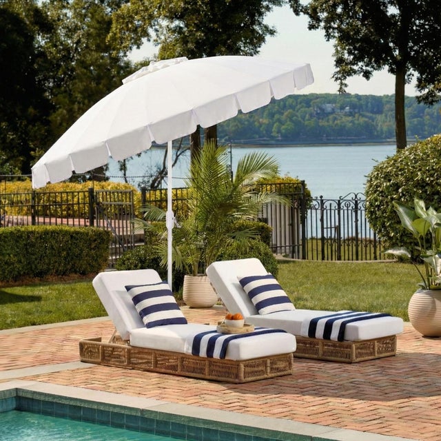 Elevate your outdoor experience with the Panza 9 ft crank umbrella in elegant ivory. Perfectly designed with a sleek white...