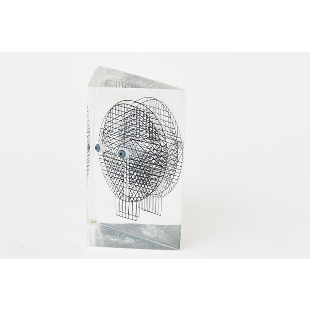 This small pop art vintage Merle Edelman grid face eyes lucite acrylic sculpture is from the 70's In the form of a...