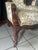 Exceptional 19th-century American Rococo Revival bergère armchair, circa 1850–1870, featuring an extensively carved wood...