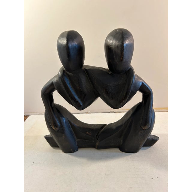 Hand carved abstract wood sculpture with signature of artist on bottom. A beautiful softened wood sculpture with great...