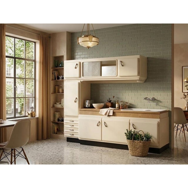 A stunning example of restored vintage kitchen design, this kitchenette perfectly captures the charm of the mid-20th...