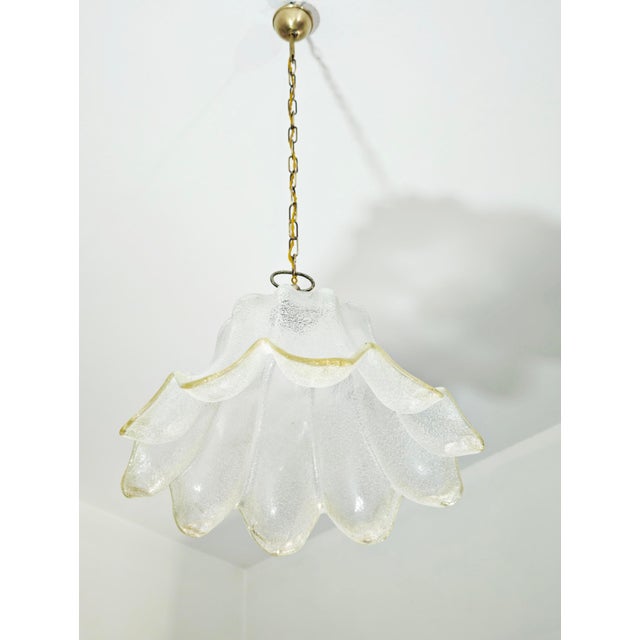 Pendant lamp with a textured, sandblasted glass shade, made in Italy in the 1960s and 1970s. Made of thick, clear glass...