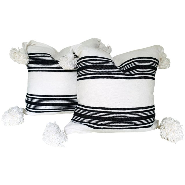 Pair of Moroccan handloomed cotton pom pom pillows with zipper closure New duck feather-and-down fill inserts. Pattern on...