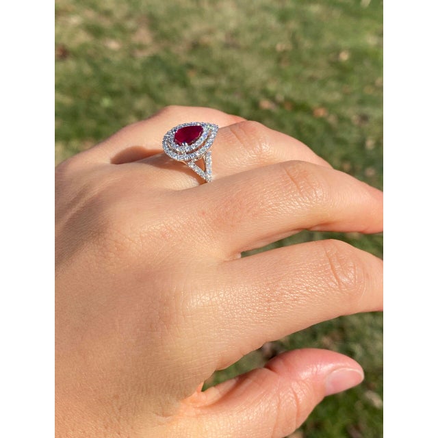 The 187th Street: Pear Shaped Natural Ruby and Double Halo Diamond Ring. The focal point of the ring is a stunning...