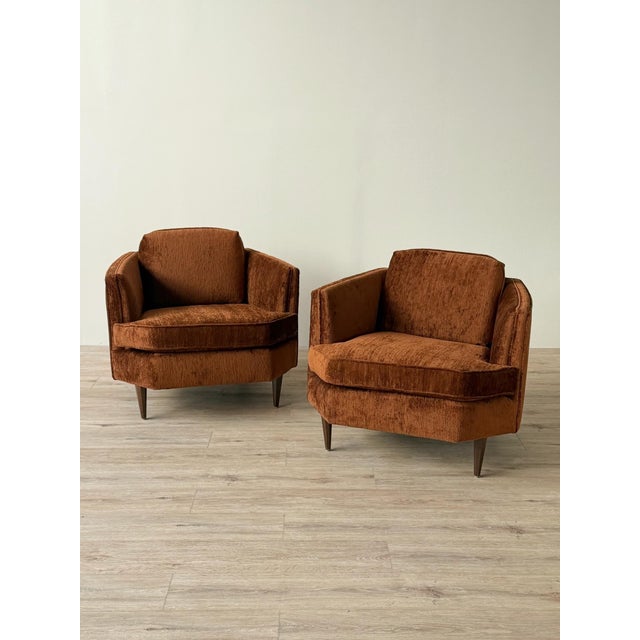 Mid-century lounge chair, newly reupholstered in chocolate brown chenille. The chair has a geometric silhouette defined by...