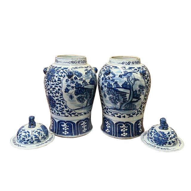 This is a pair of handmade porcelain container urn temple general jar in the distressed off-white base color. The surface...
