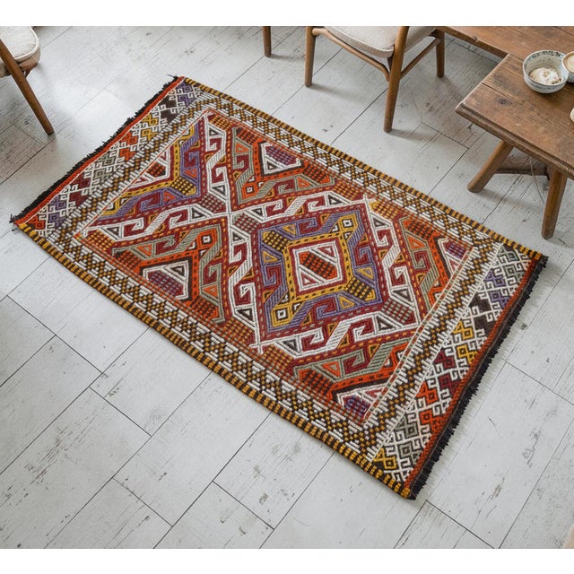 Woven by the Yoruk nomads of the Mersin Mut region in Mediterranean Anatolia, this striking 1970s vintage cicim flatweave...