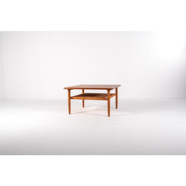 Elegant Danish mid-century square coffee table designed by Kurt Østervig for Jason Møbler in the 1960s. Made from teak...