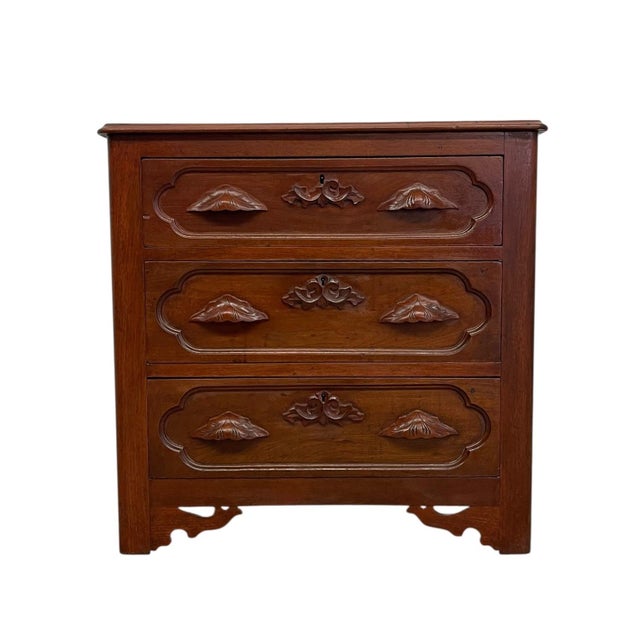 This French Provincial style chest features three spacious drawers with richly carved foliate detailing and shaped panel...