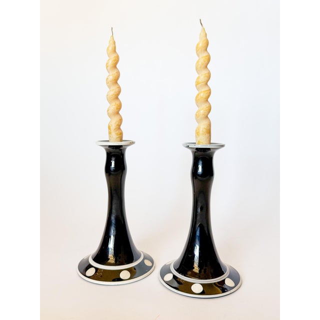 Stunning pair of Art Deco style rich noir black glass candlestick holders with the smoothest curves and finish. These...