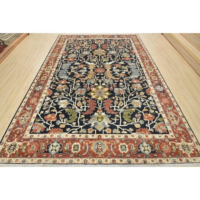 This traditional Ziegler rug is hand-knotted with an all-wool pile on a cotton foundation. This rug is new and in...