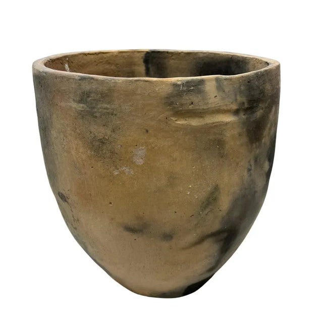 This Gafsa clay vessel hails from Tunisia, specifically the town of Gafsa known for its pottery craftsmanship. This...