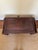 Ornate low table featuring carved wood vine and leaf detail on bowed legs, apron and interior surround. Good condition....