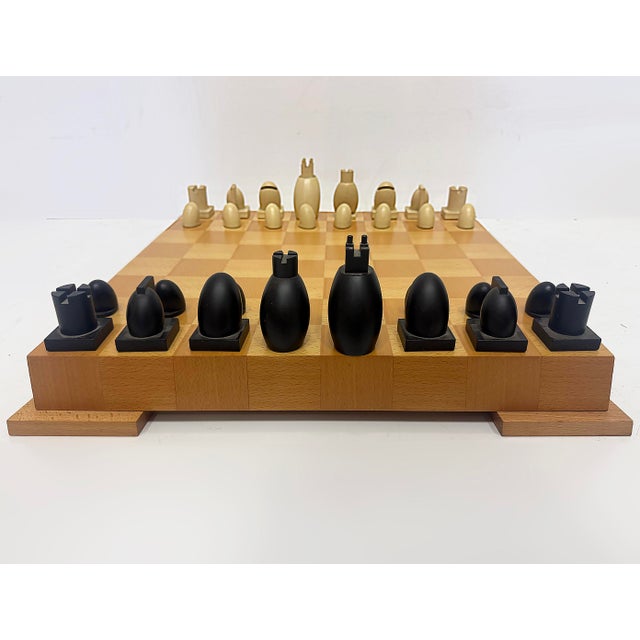 Vintage Post Modern Michael Graves Chess Set, Maple Board Offered for sale is an iconic 1990s Michael Graves Chess Set...