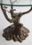 A sculptural Belgian bonsai table, circa 1970s, attributed to Willy Daro. The brass base takes the form of a stylized...