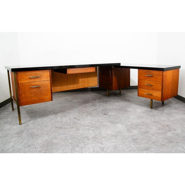 Outstanding executive desk with all kinds of unique features: Black formica top surface, walnut construction, cane front,...