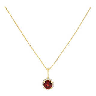 10K Yellow Gold Red Garnet and 1/10 Cttw Diamond Accent Halo Pendant Necklace For Sale