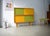 This is a modular vintage sideboard with glass sliding doors from the renowned German company Hellerau. Hellerau furniture...