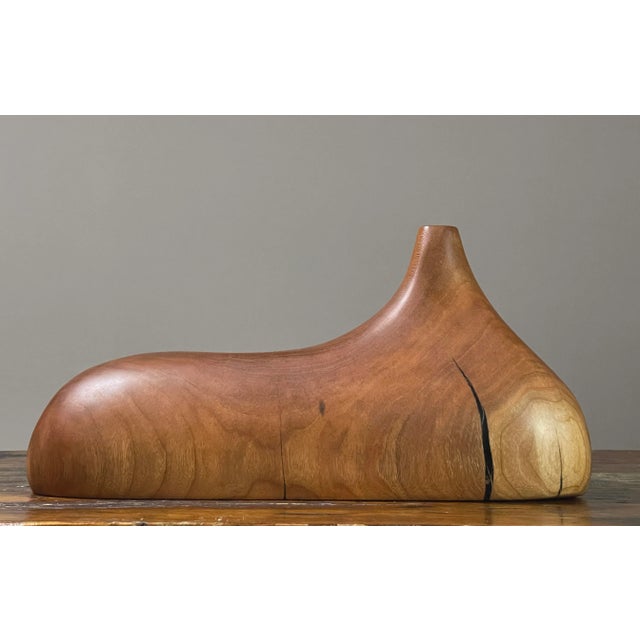 Biomorphic Hand Carved Cherry Wood Vessel. Hand carved cherry wood biomorphic vessel with opening. Carved from a single...