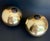 Exceptional pair of oversized French eglomisé glass decorative spheres dating from the mid-20th century. These sculptural...