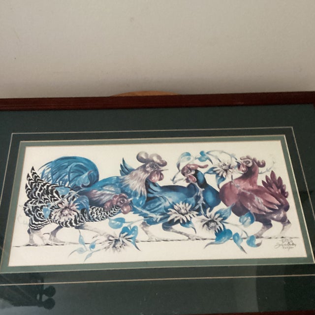 Immerse yourself in the vibrant essence of the countryside with the Colorful Group of Roosters watercolor print, numbered...