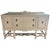 Vintage sideboard featuring a soft warm beige painted finish with carved detailing and turned legs. Two center drawers are...